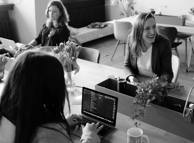 image of women sitting at the desk